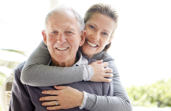 Beautiful young woman embracing her father