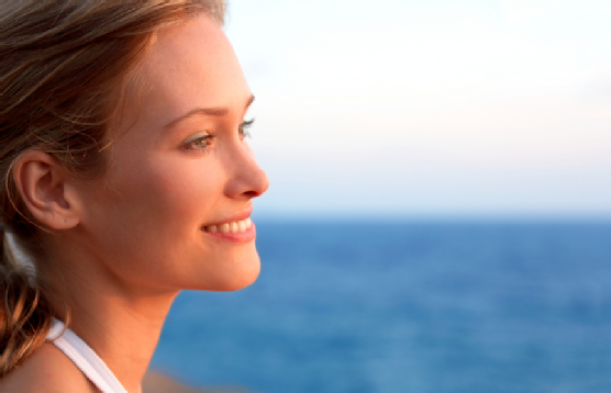 Portrait of a beautiful woman by the sea